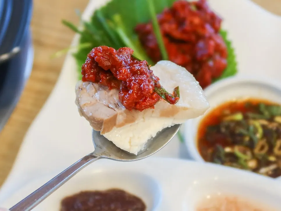 Handmade tofu topped with bossam and skate jeotgal