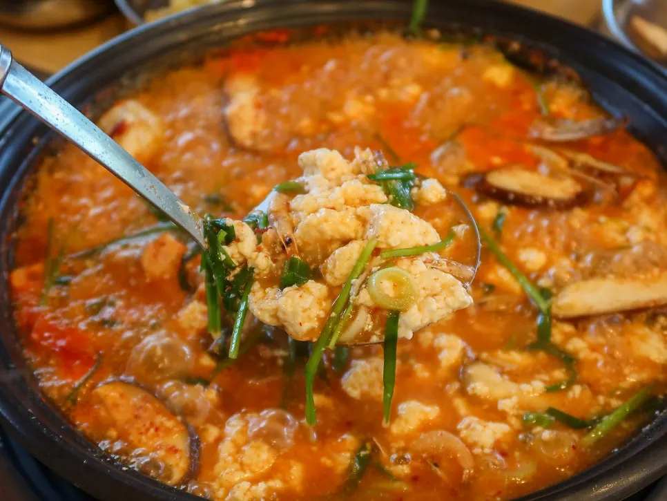 Spicy sundubu jjigae packed with vegetables and seafood