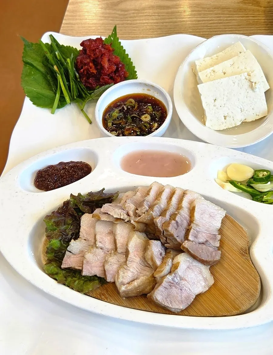 A spoonful of sundubu eaten with rice