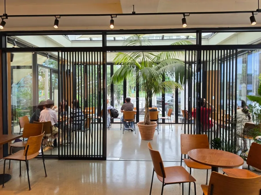 Café interior in wood and white tones