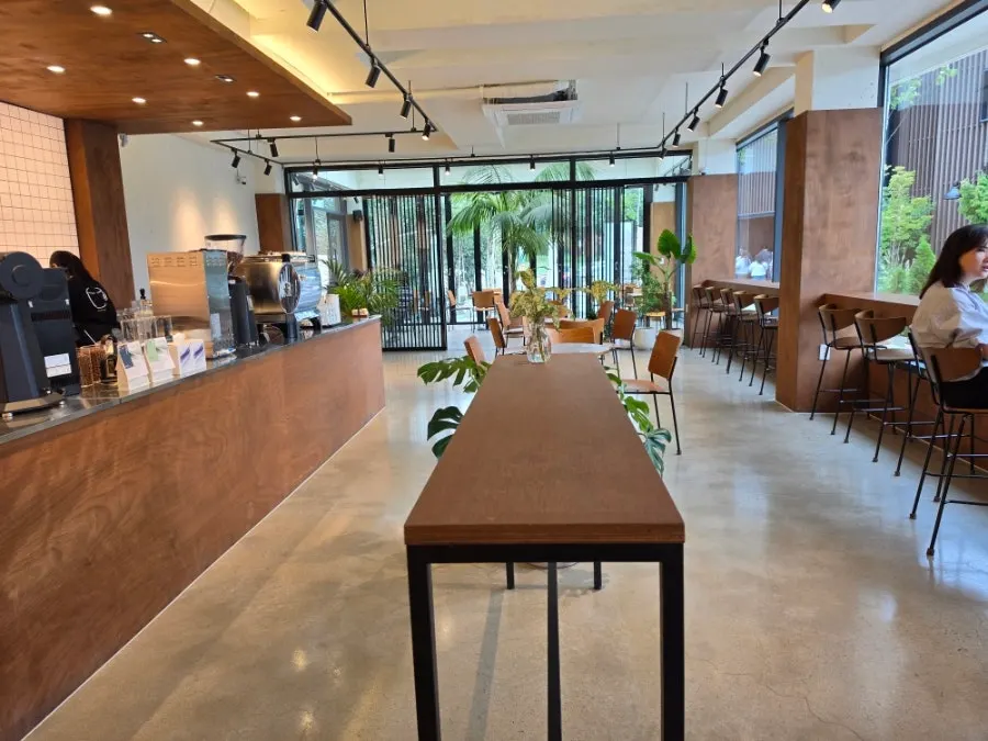 Café seating beside floor-to-ceiling windows