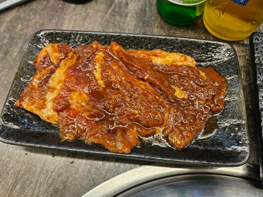 Diced sirloin grilling on the charcoal fire