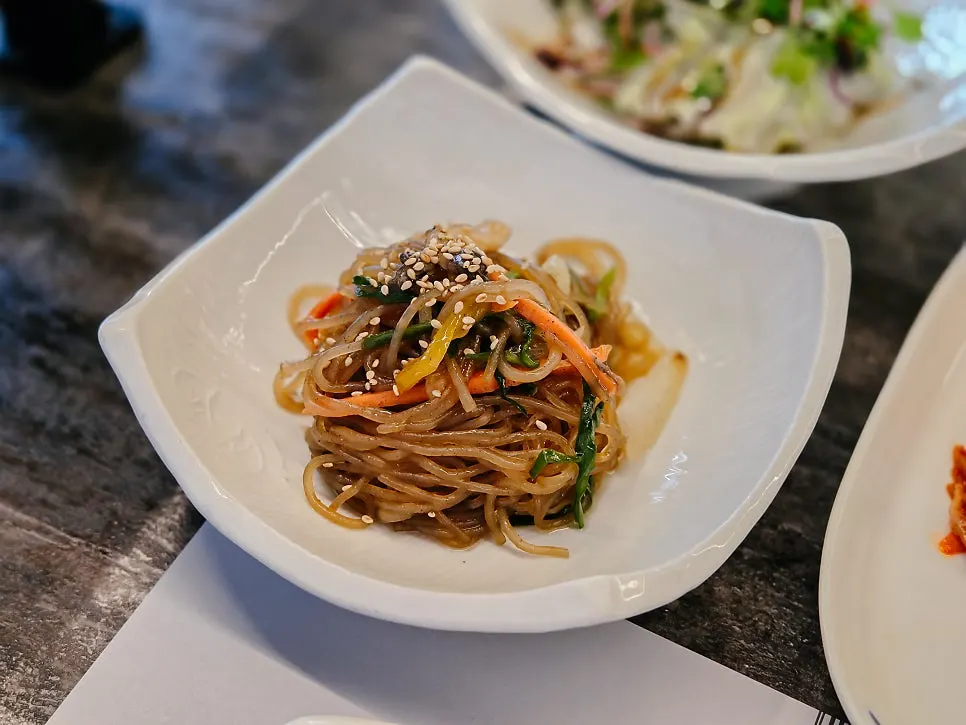 Japchae and other accompanying side dishes