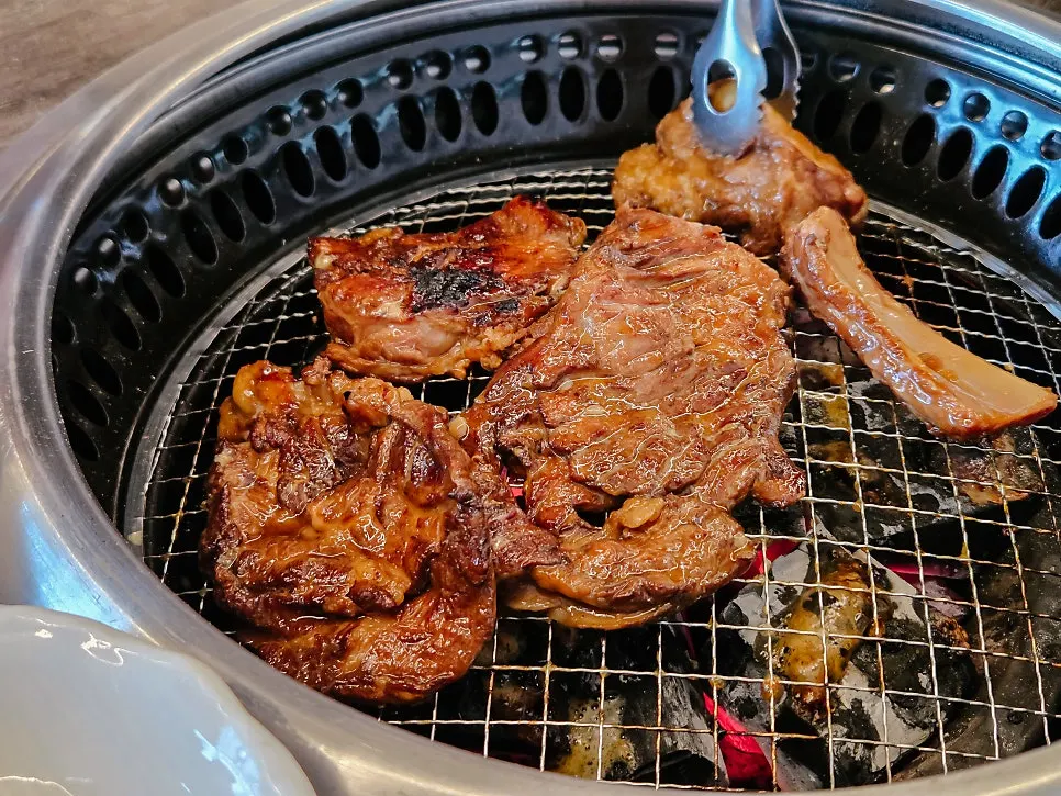 Marinated pork galbi cooking over charcoal