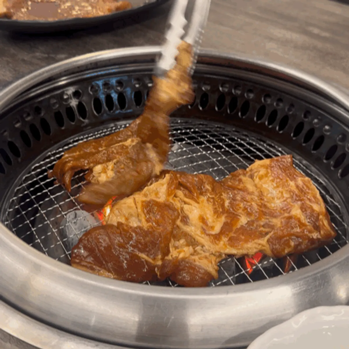 Table setting for two servings of fruit-marinated pork galbi at Chodang Uga