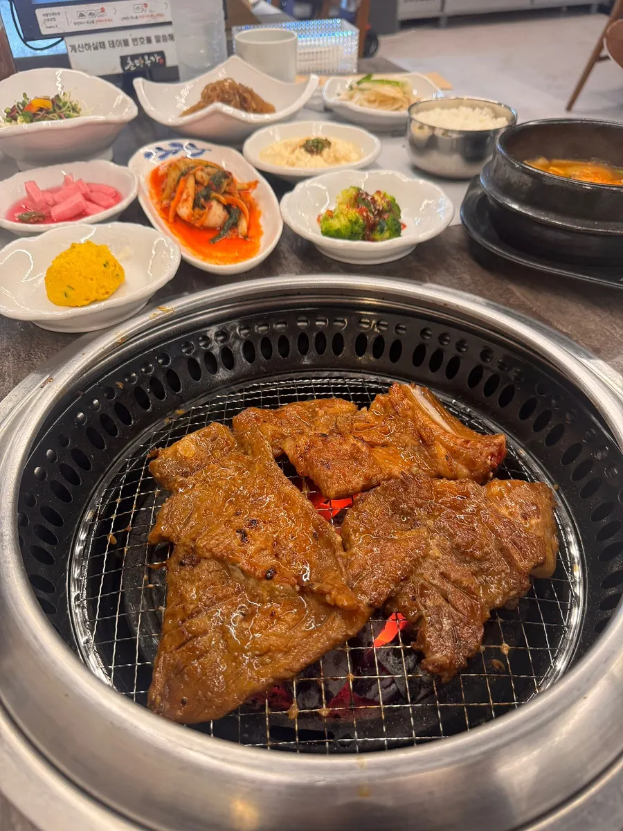 Fruit-marinated pork galbi placed on the grill