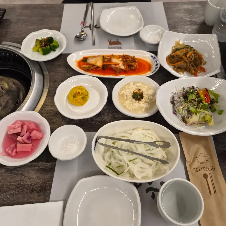 Full table spread of basic side dishes at Chodang Uga