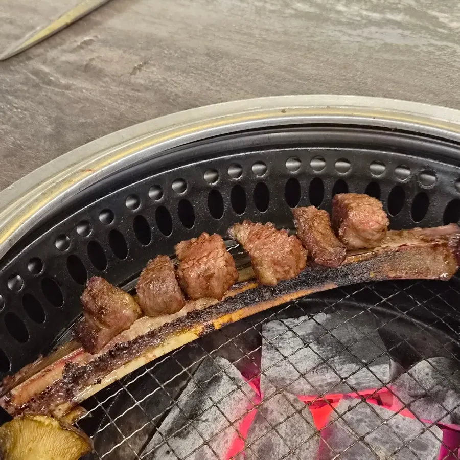 Woo-dae galbi ribs grilling over charcoal