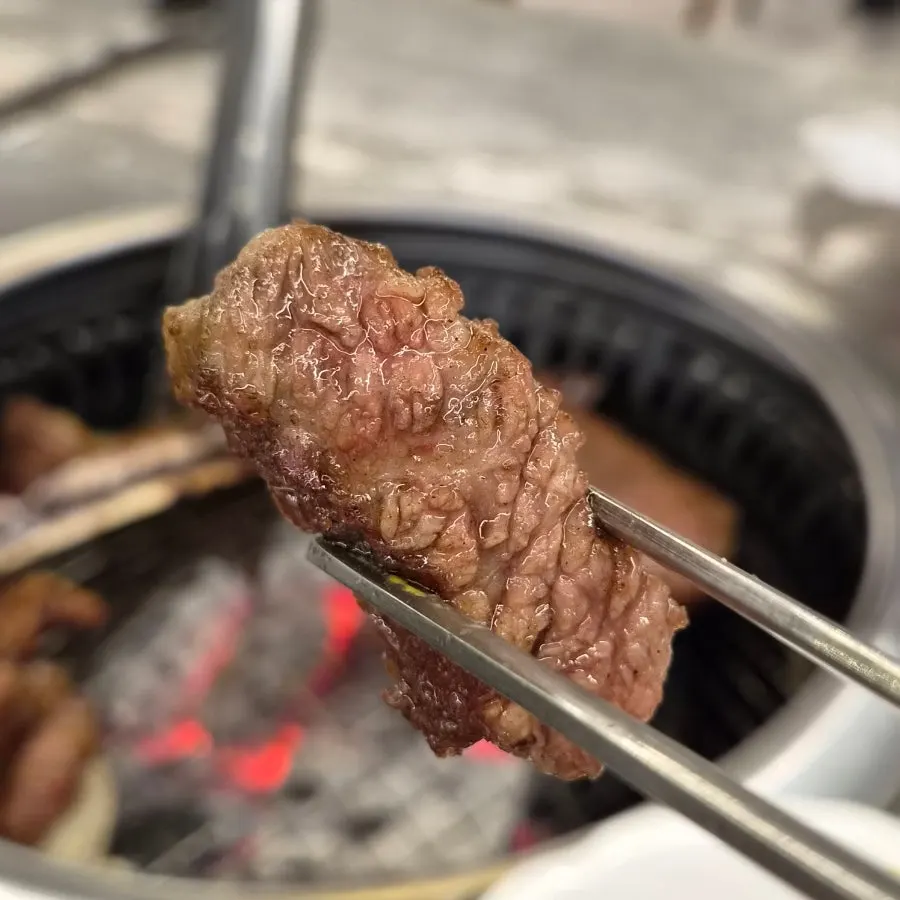 Cross-section of a sliced, grilled piece of woo-dae galbi