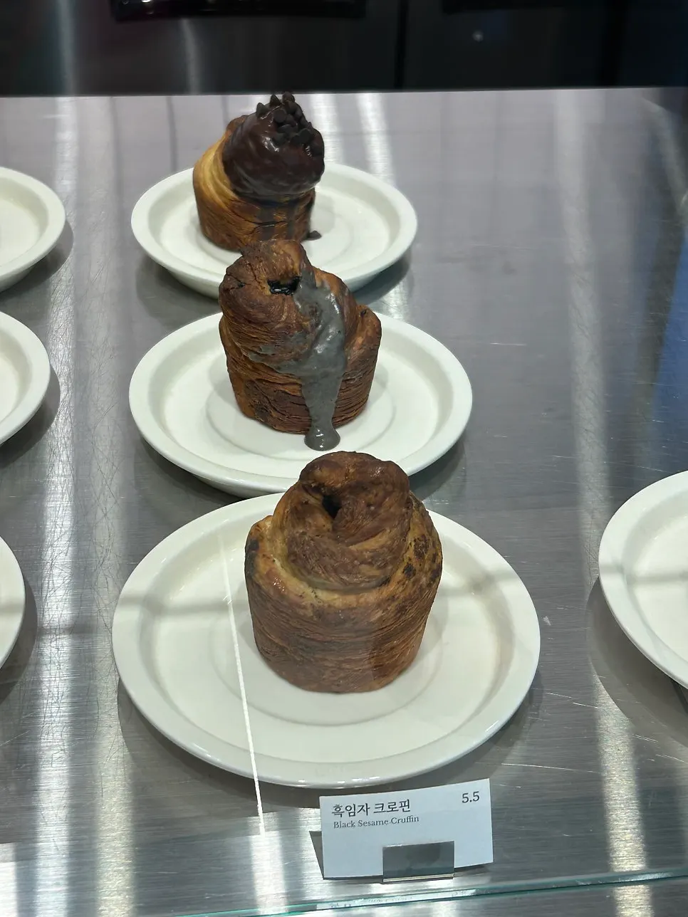 Croffin topped with cream and chocolate