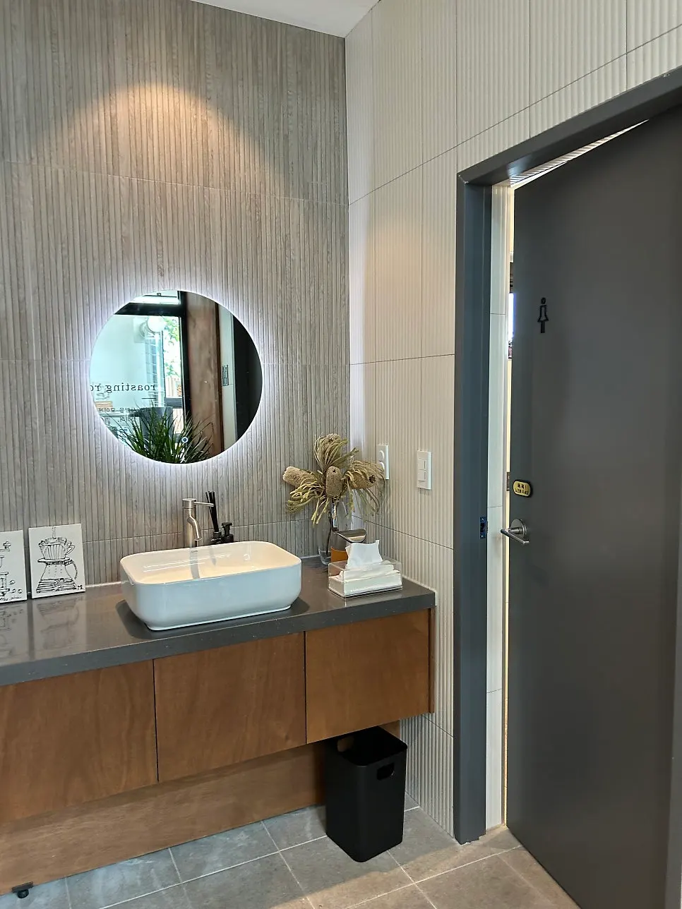 A neatly maintained café bathroom