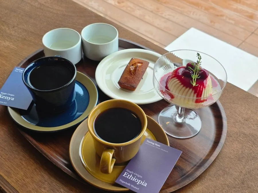 Table set with drip coffee and desserts