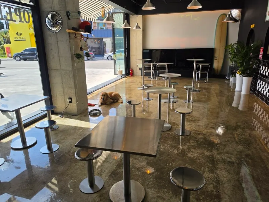 Metal tables inside Moana Burger