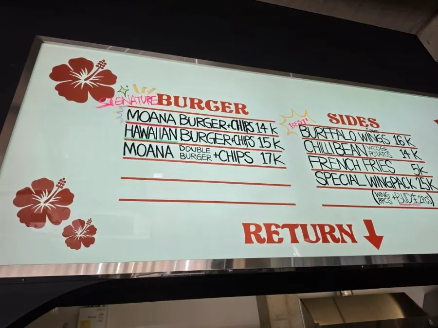 Enjoying a beer at Moana Burger