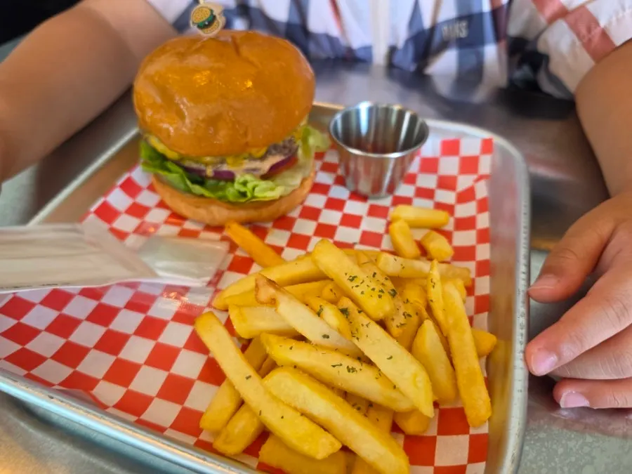 Two handmade burgers set out on the table