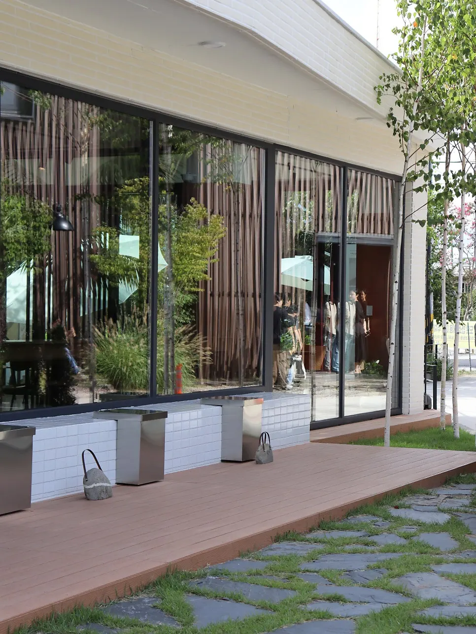 Grass-covered outdoor terrace seating at Coffee Dripper