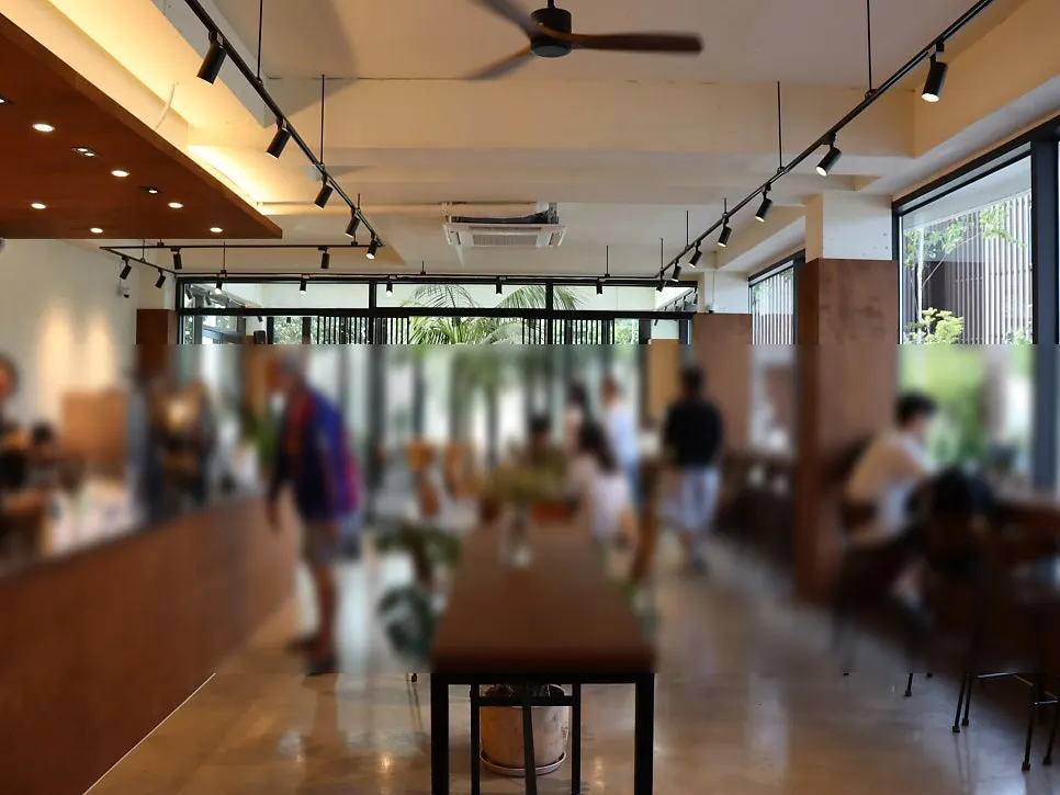 Seating by floor-to-ceiling windows overlooking outside scenery