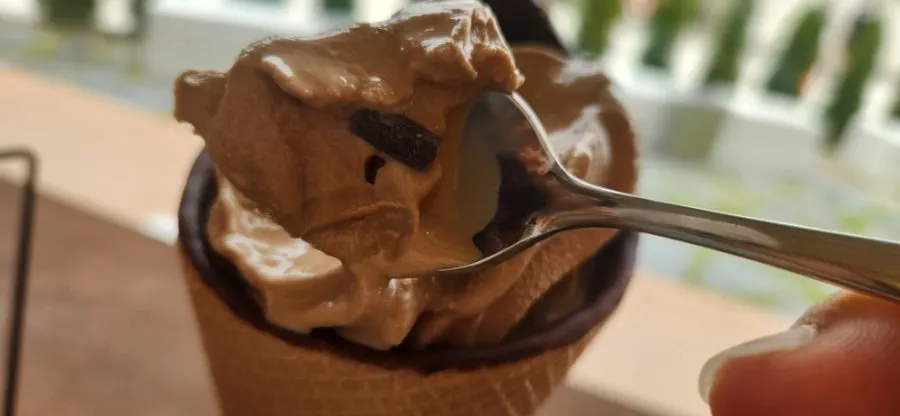 Close-up of the cone affogato served alongside espresso