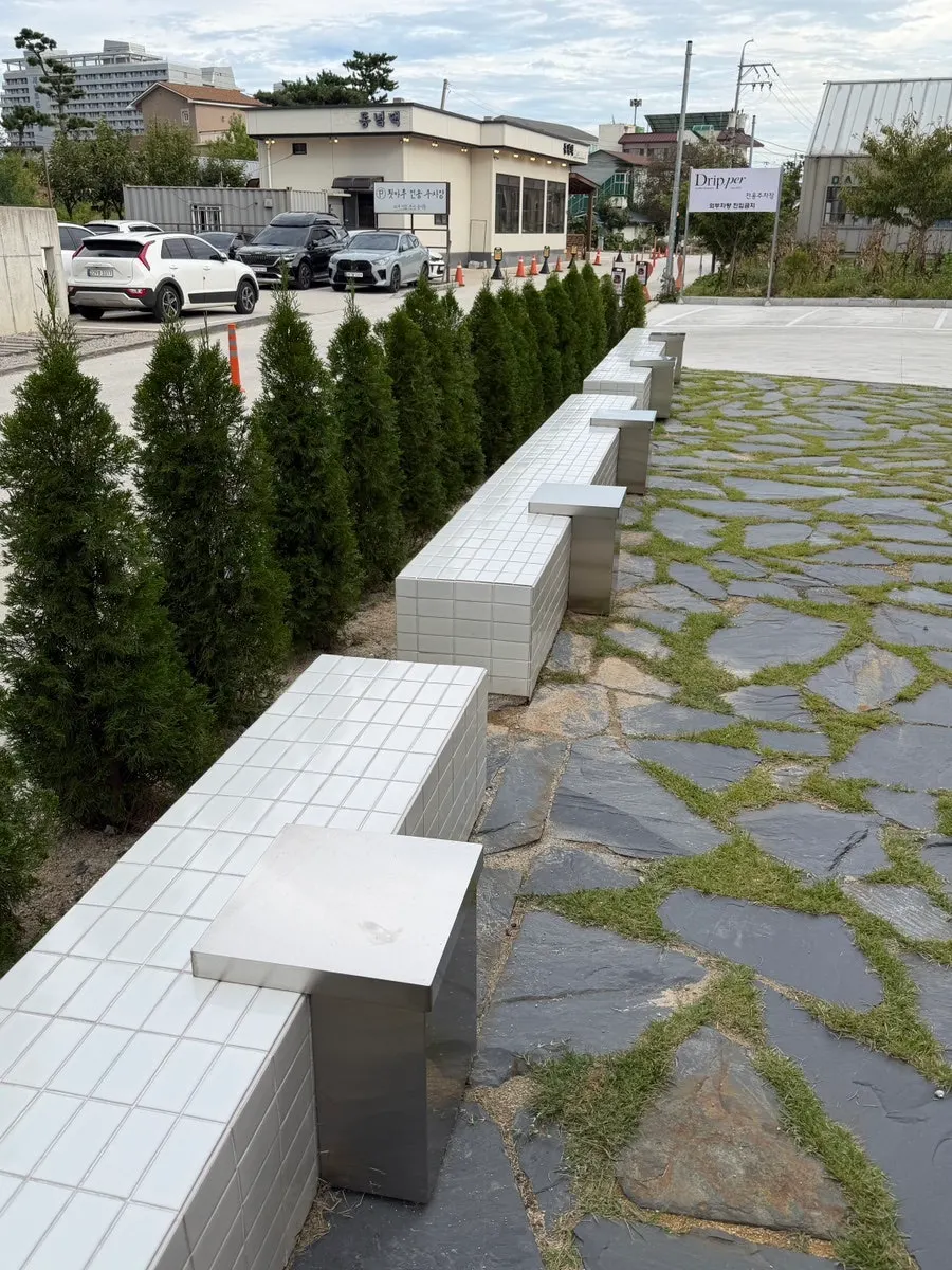 View of outdoor seating in front of the Coffee Dripper building
