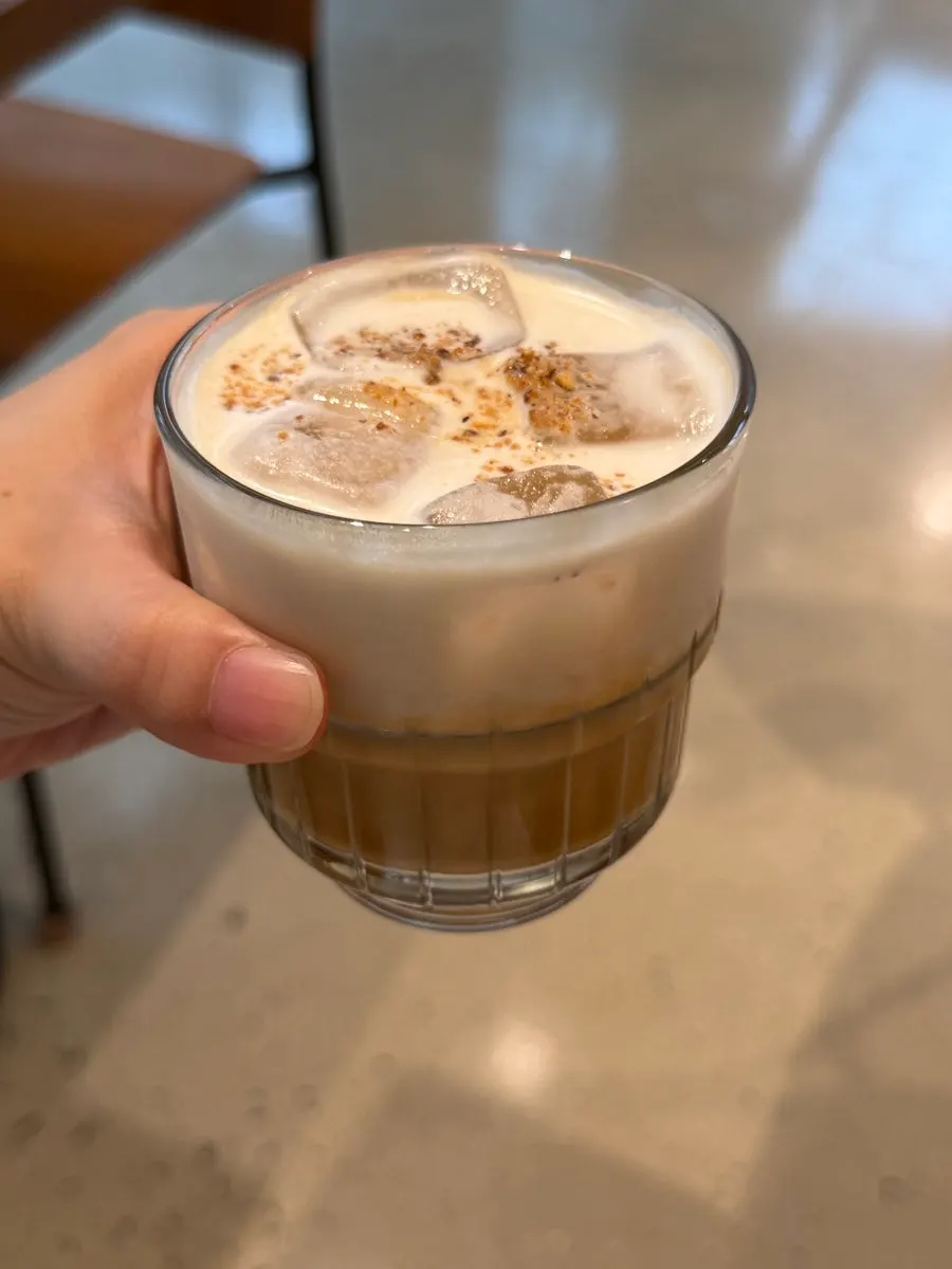 A cup of white almond mocha dripper latte