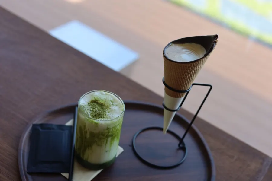 Cone choco latte and pine needle matcha latte on the table