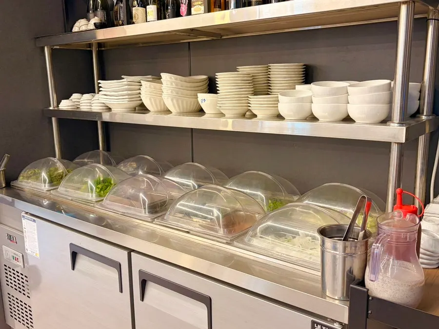 Covered side dishes at the self-serve bar in Chodang Uga
