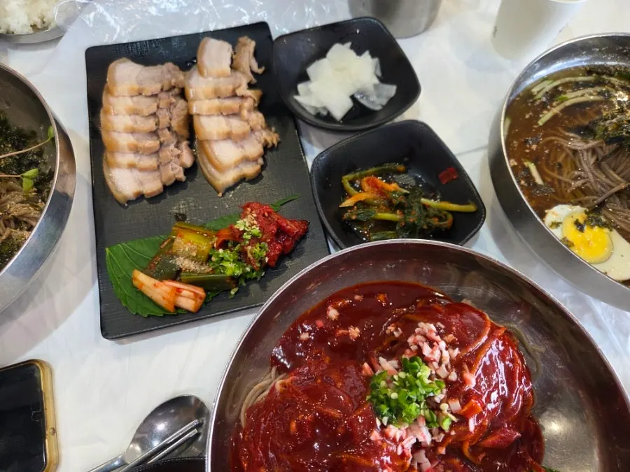 Table set with makguksu and buckwheat gimbap