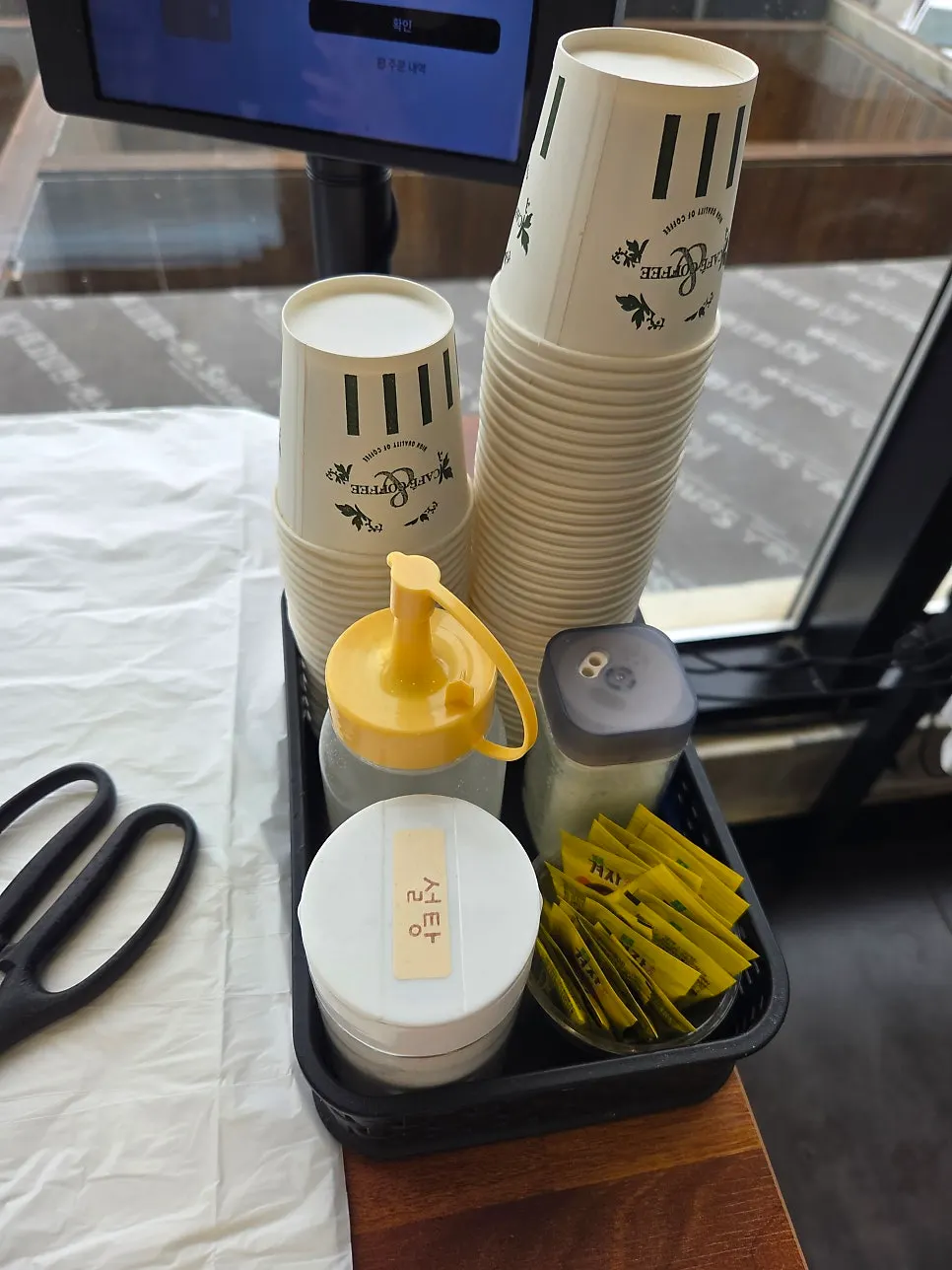 Vinegar, mustard, and sugar on the table