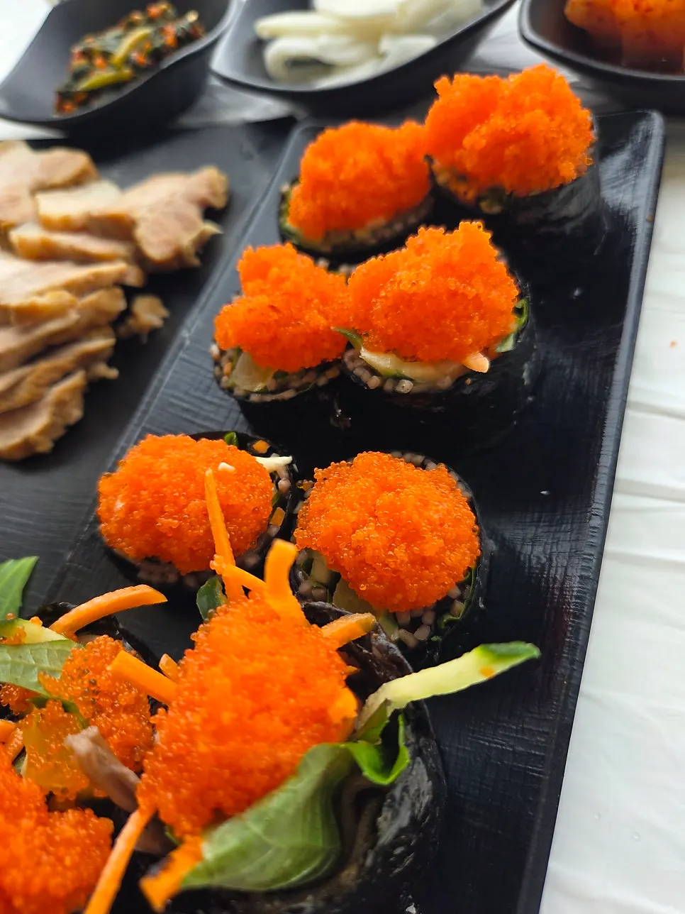 Buckwheat gimbap topped with flying fish roe