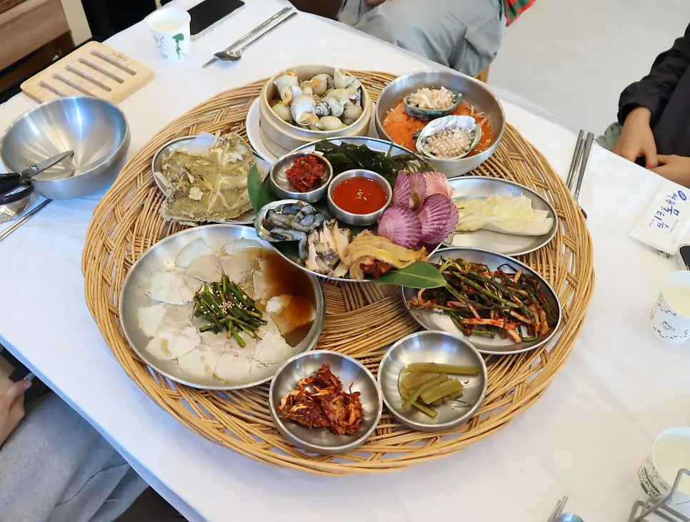 Table set with pressure-cooker abalone porridge and abalone perilla seaweed soup