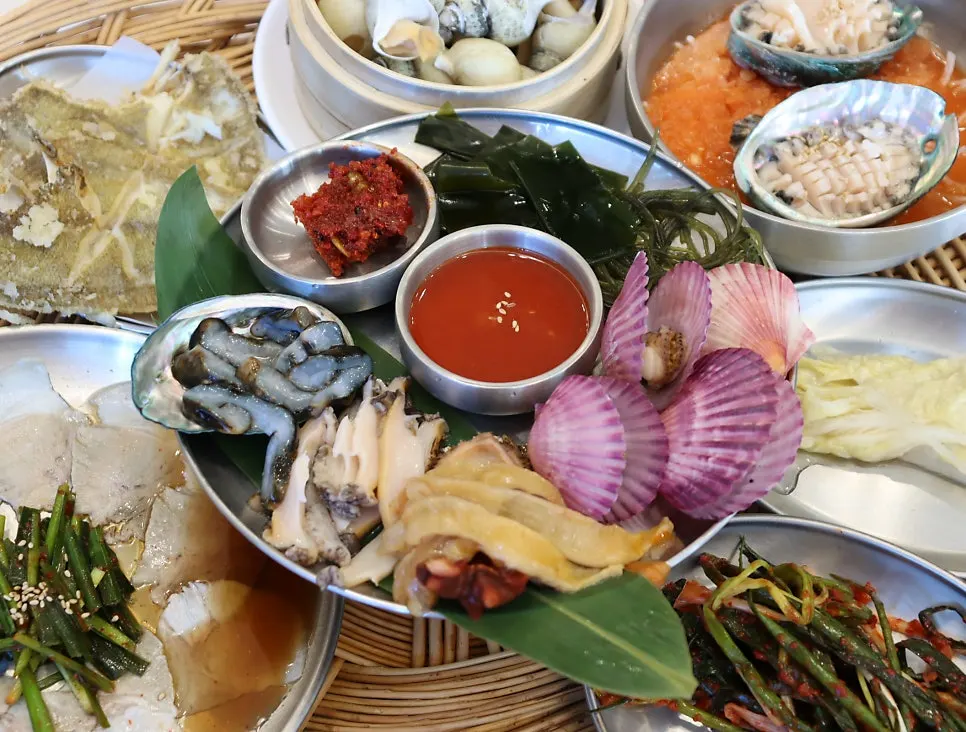 Full haenyeo table packed with seafood