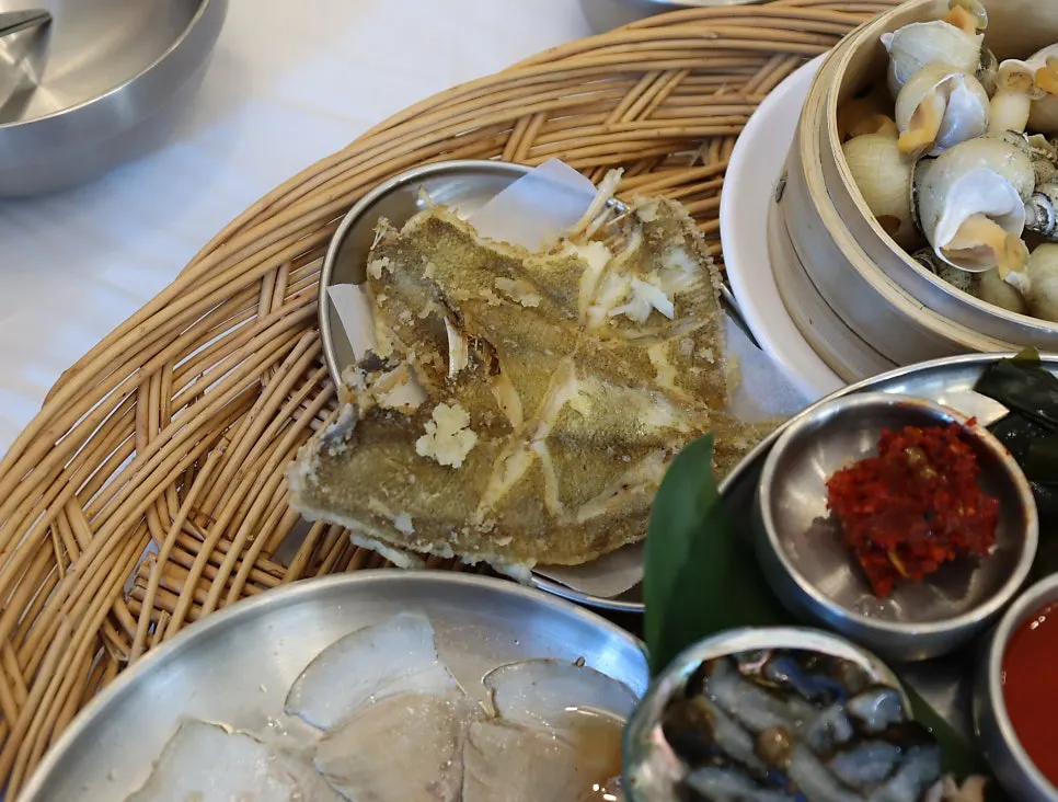 Over a dozen side dishes set out on the table