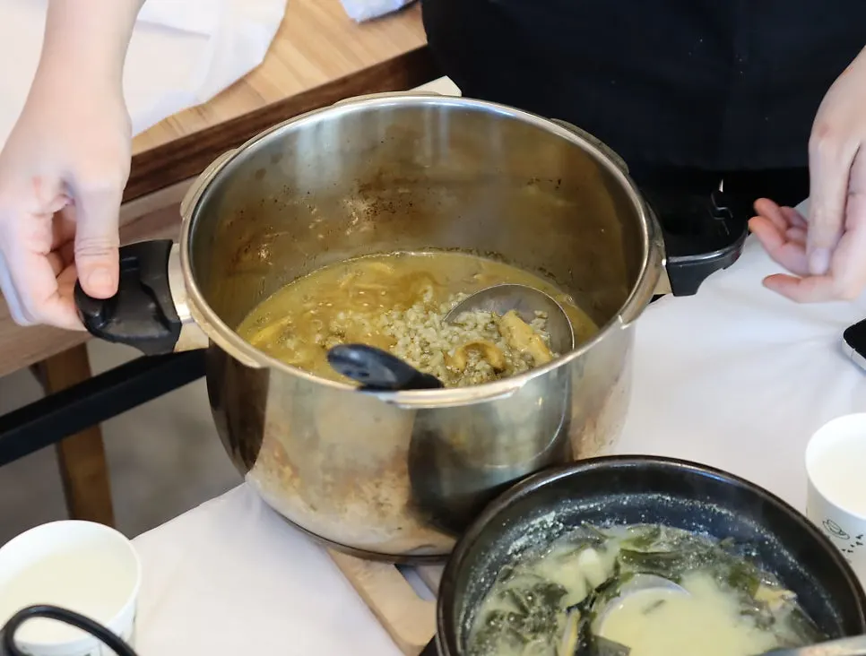 Pressure-cooker abalone porridge served pot and all