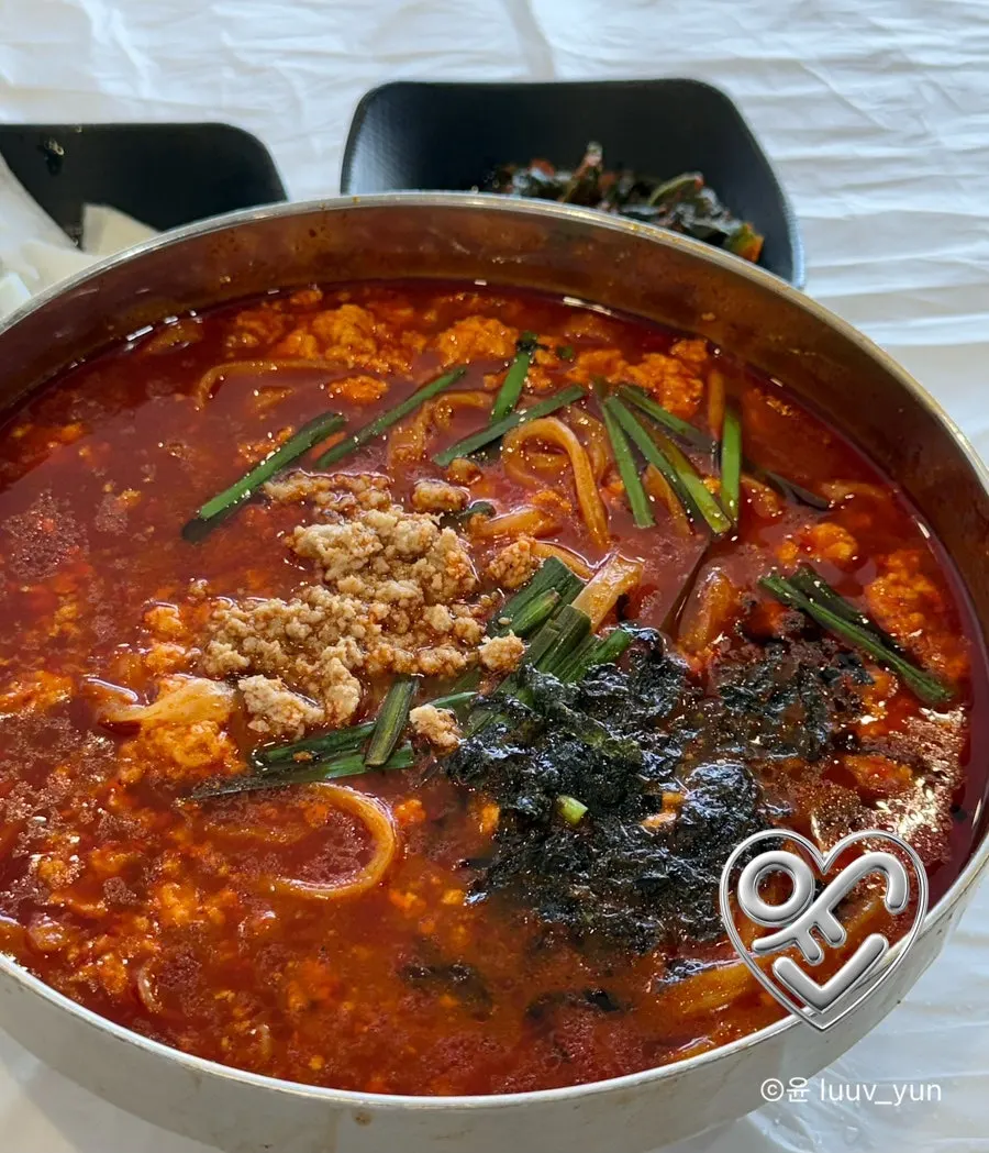 A bowl of spicy sundubu kalguksu