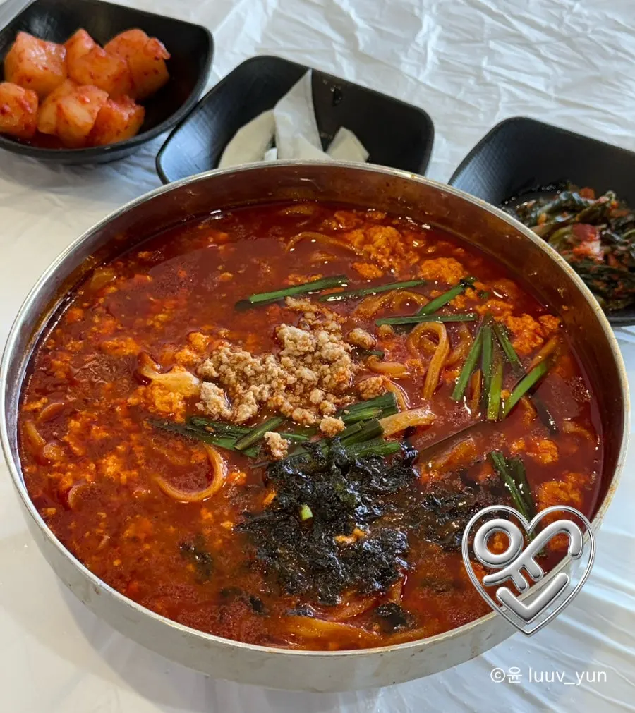 Close-up of Chodang sundubu and kalguksu noodles in spicy broth