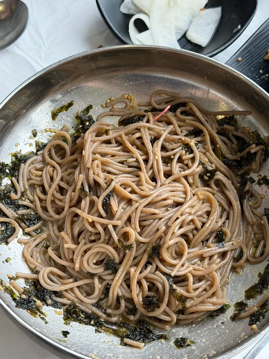 Broth served alongside the perilla oil makguksu