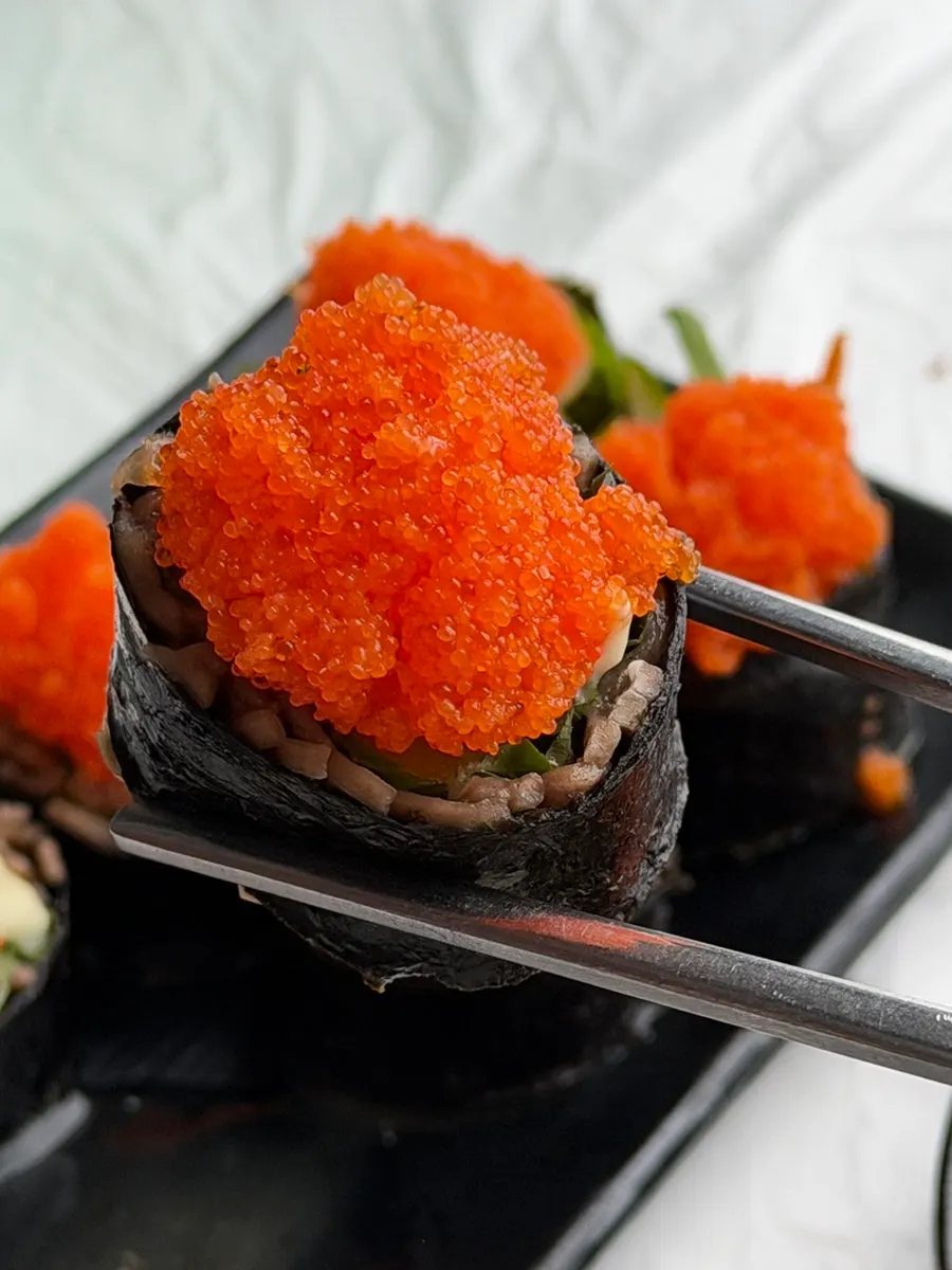 Flying fish roe buckwheat gimbap with crunchy vegetable filling
