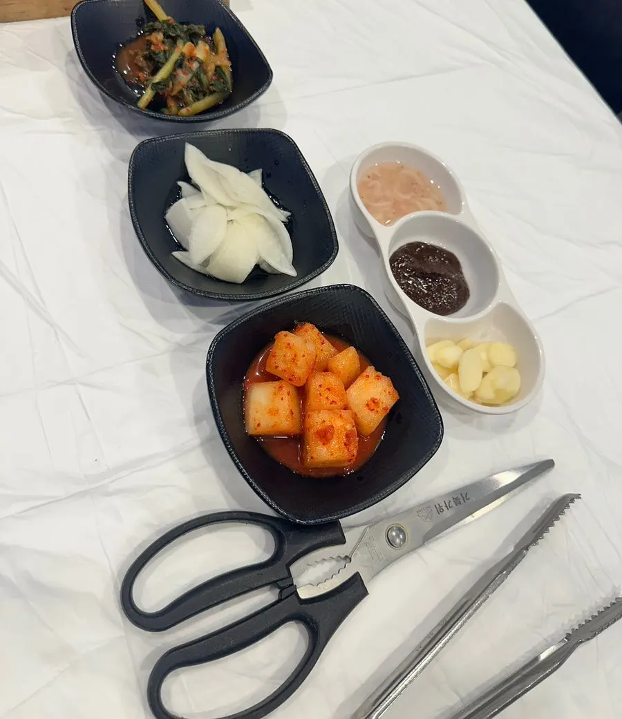 Basic table setting with yeolmu kimchi and lettuce wraps
