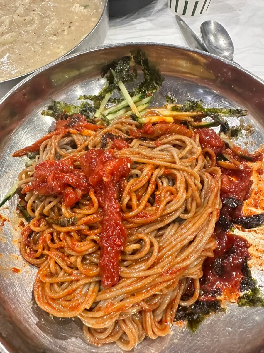 Noodles lifted out of the perilla sundubu kalguksu