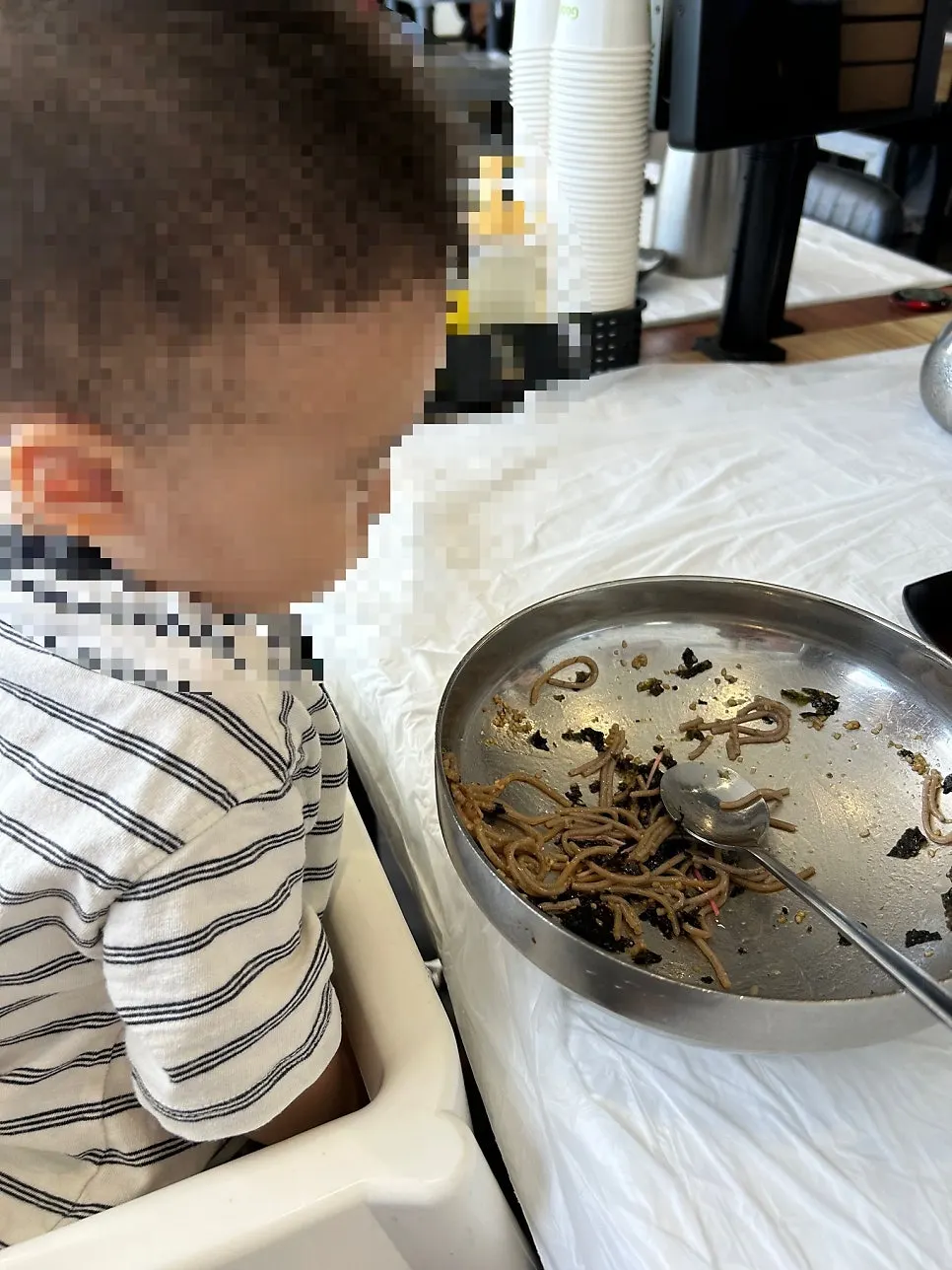 Perilla oil makguksu noodles lifted with chopsticks