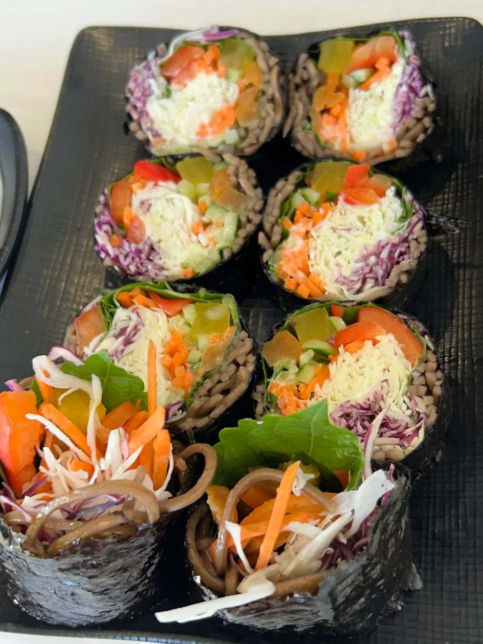Cross-section of salad buckwheat gimbap filled with vegetables