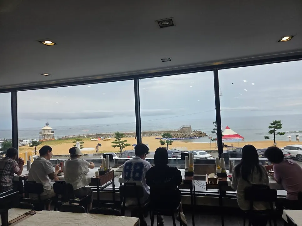 Ocean-view window table overlooking Gangmun Beach