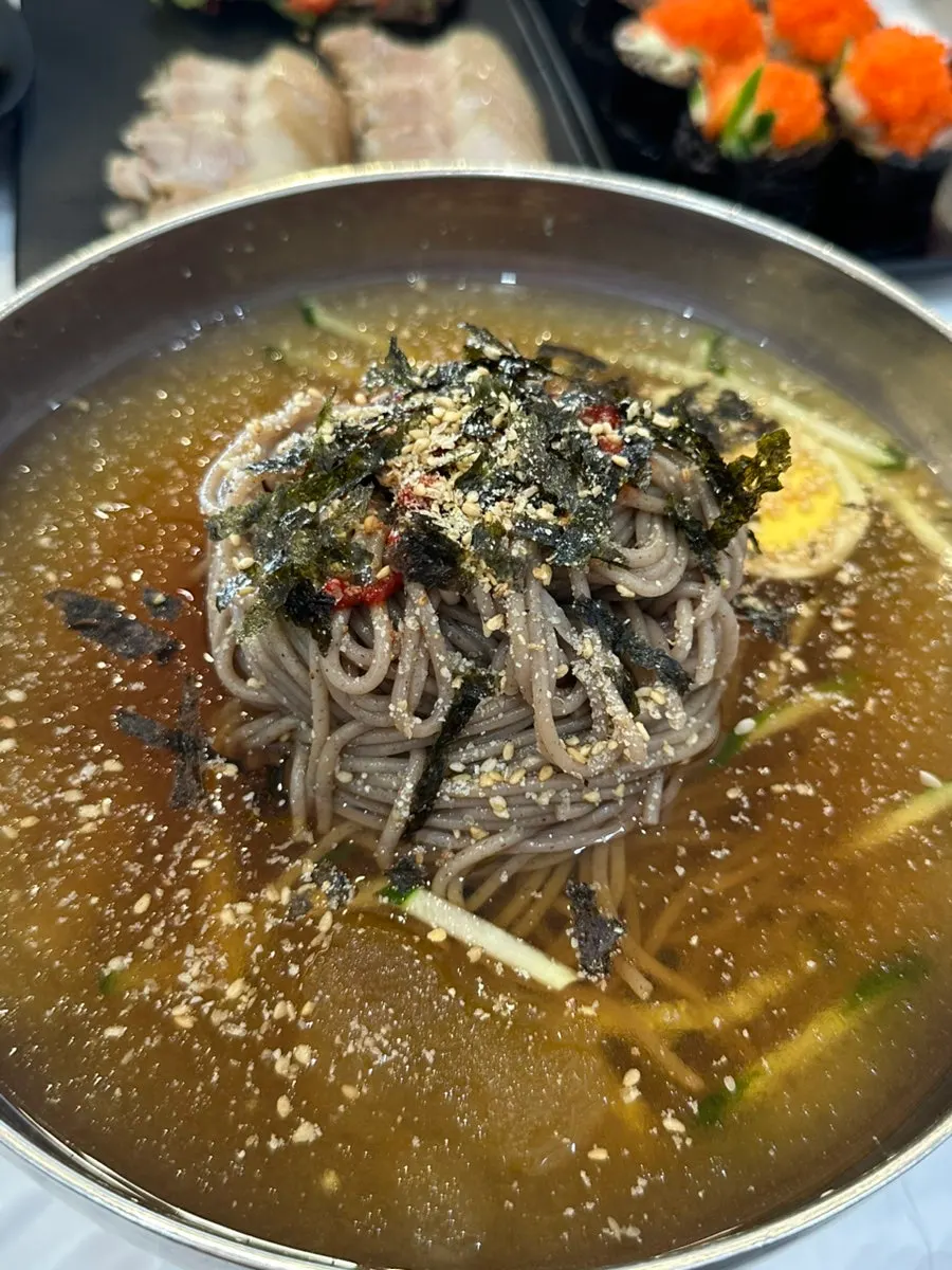 A generous portion of makguksu noodles and toppings