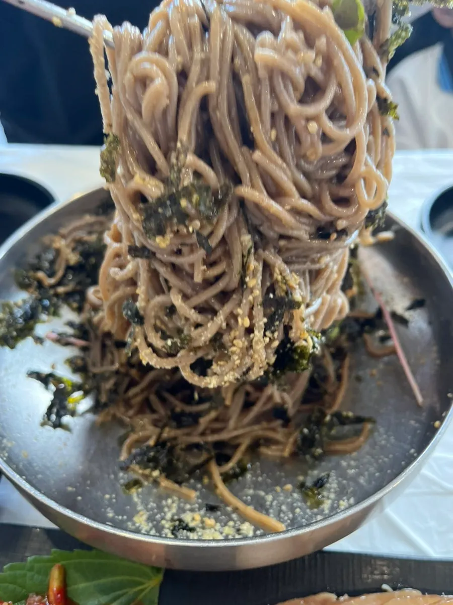 Perilla oil makguksu noodles mixed together