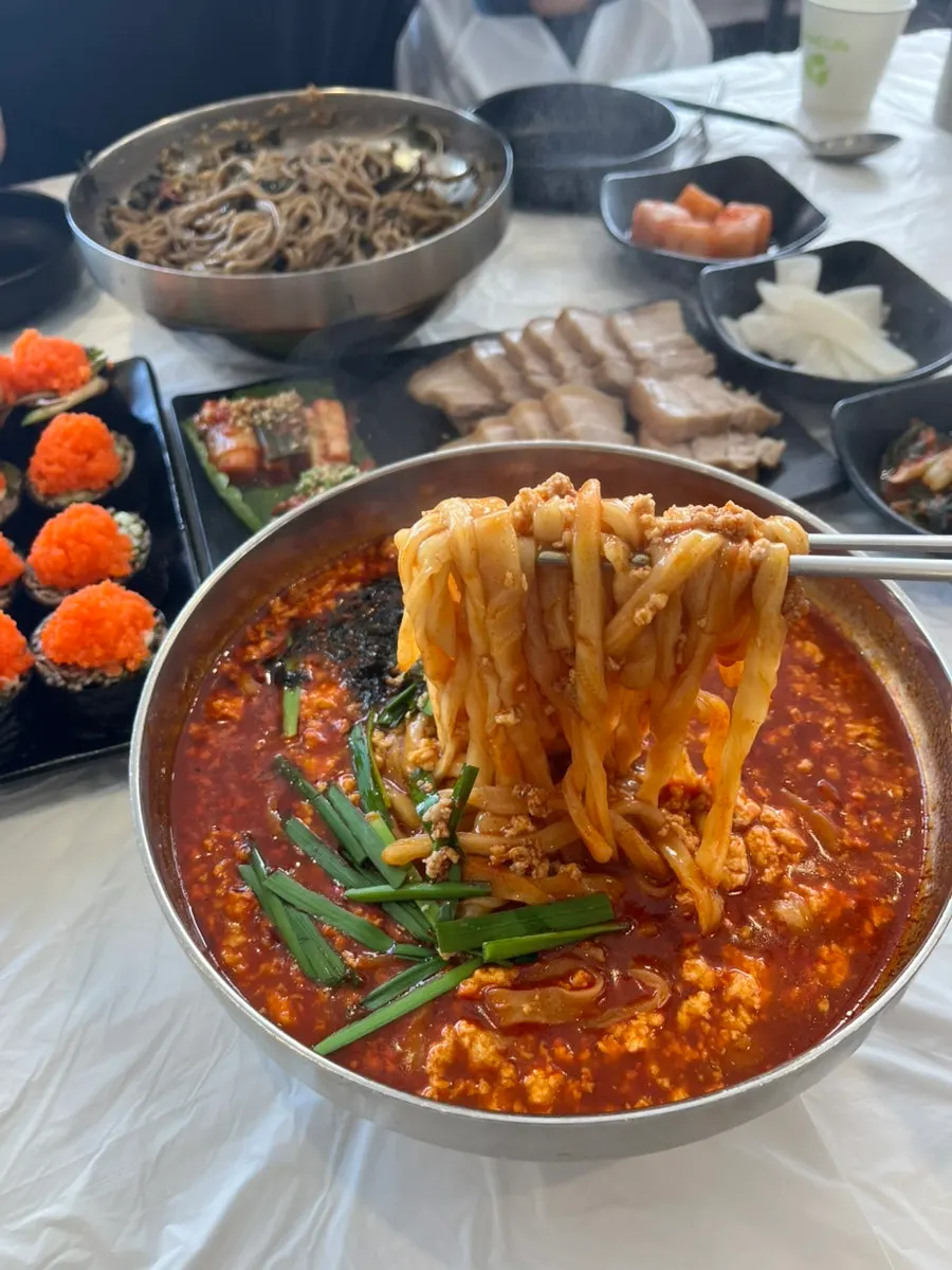 Sundubu-jang kalguksu loaded with soft tofu