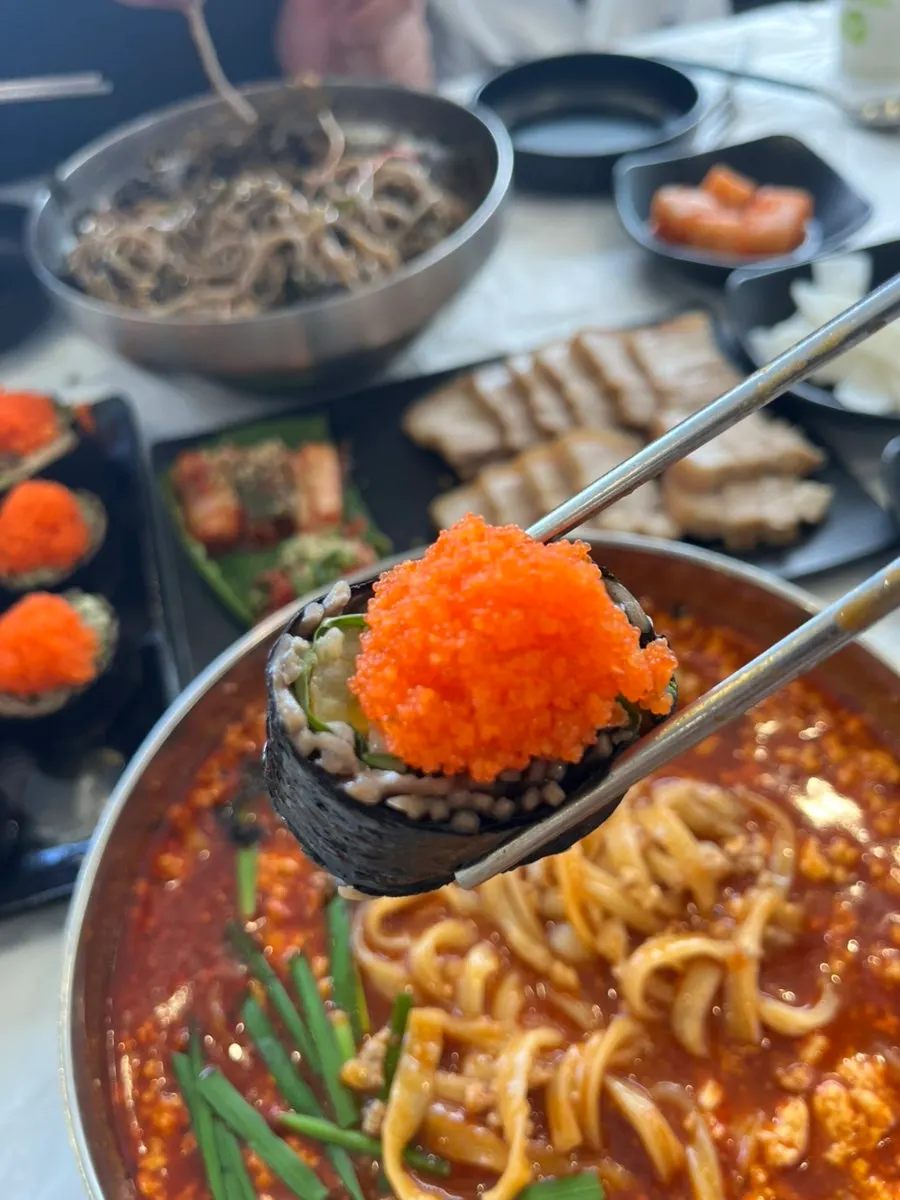 Broth and noodles of sundubu-jang kalguksu