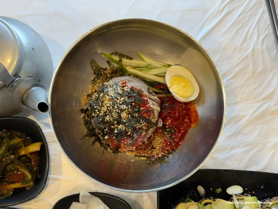 Table spread with makguksu and sundubu