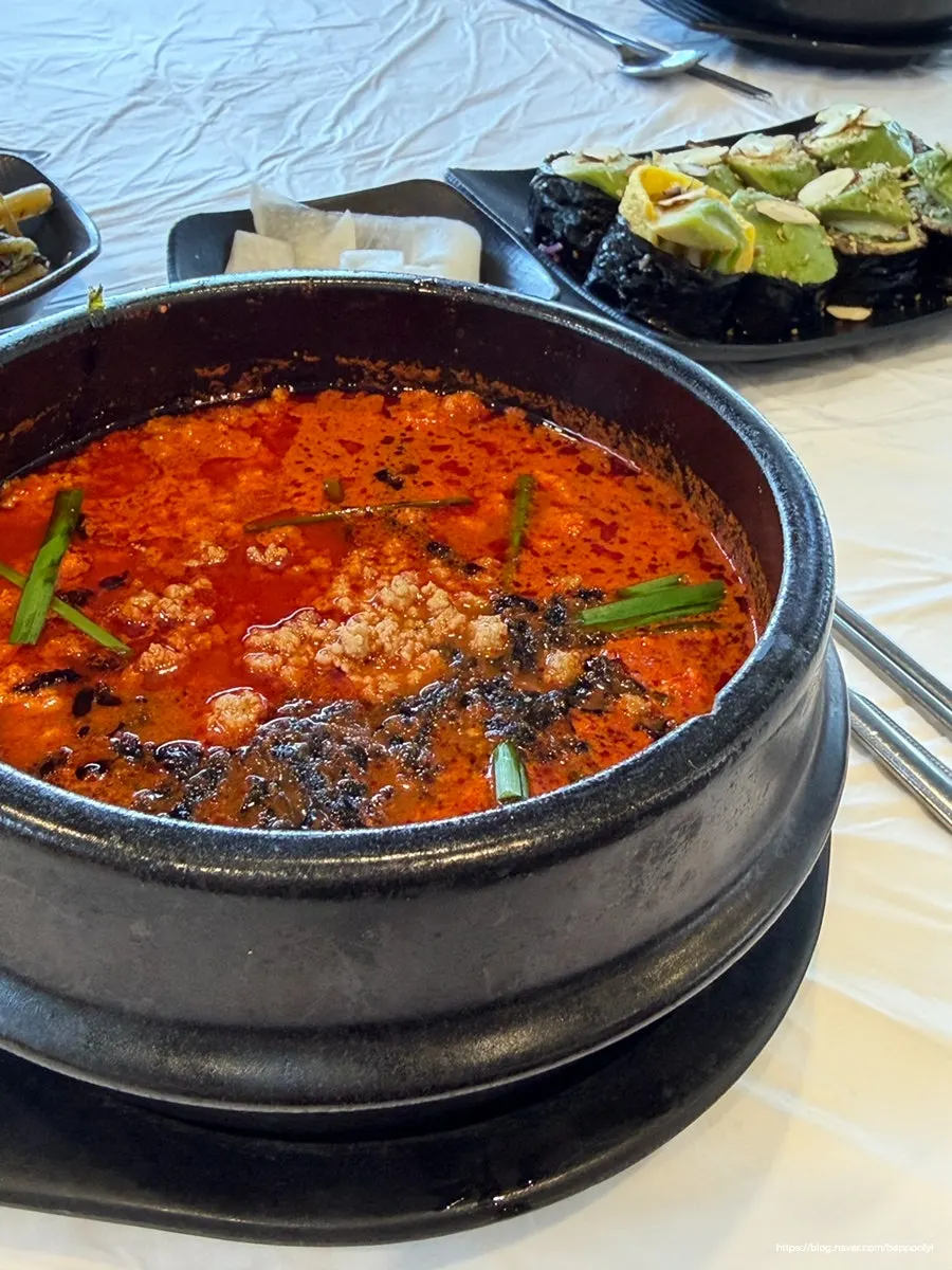 Close-up of the red broth of the spicy sundubu
