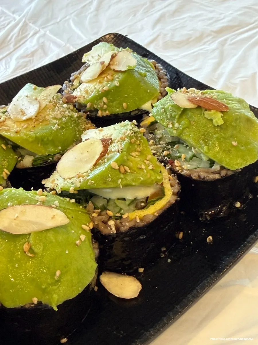 Cross-section of buckwheat gimbap with avocado and cucumber