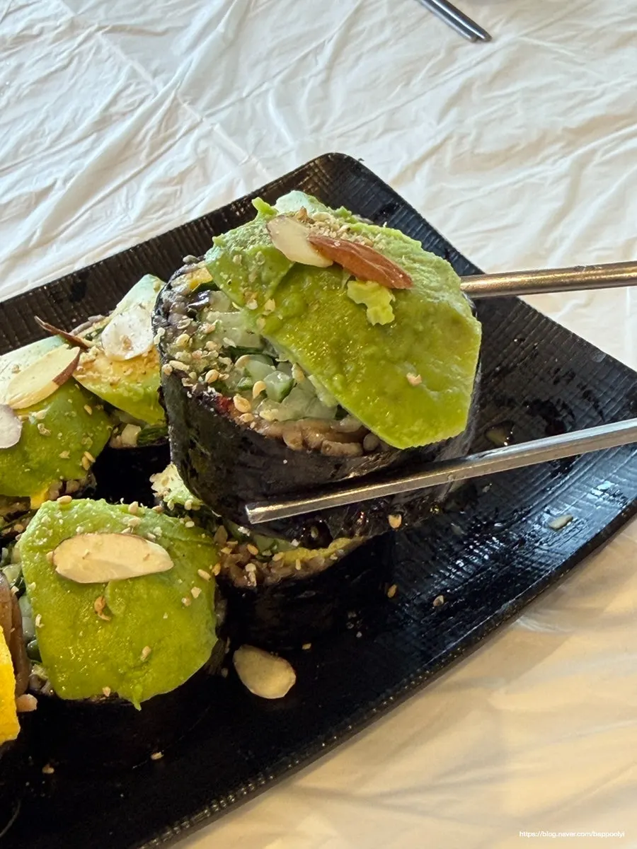 Picking up a piece of buckwheat gimbap